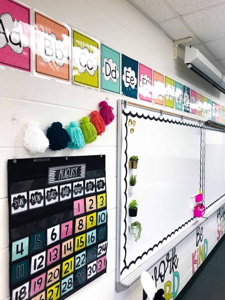 A black calendar pocket chart to help organize the classroom. I've featured my bold brights calendar pack from my first classroom makeover
