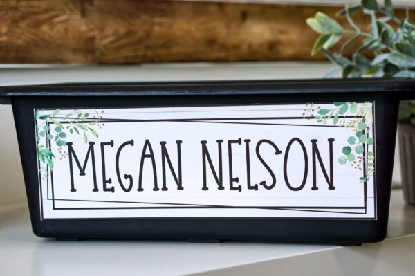 Modern Farmhouse Classroom Decor Bundle - Desk Name plate Shows an example student desk nameplate with the name "Megan Nelson". Includes design elements from the modern farmhouse classroom theme
