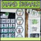 Shows the hand signals from the plant classroom theme set up in a real classroom next to the classroom calendar and bulletin board
