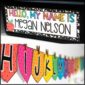 Shows an example desk name plate with the text "Hello My Name is Megan Nelson"