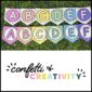 Shows the alphabet banner A to F in two different bright and simple alphabet banners. The banners are laid on a set of grass panels to highlight the bright colors