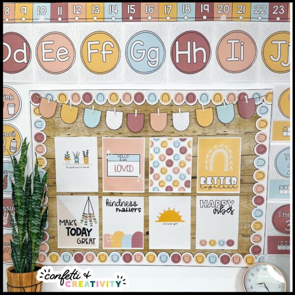Modern Neutral Classroom Decor - Bulletin Board Shows the bulletin board decorated with neutral classroom inspirational posters. The edges of the board are filled with printable bulletin board borders. Above the board are neutral alphabet posters
