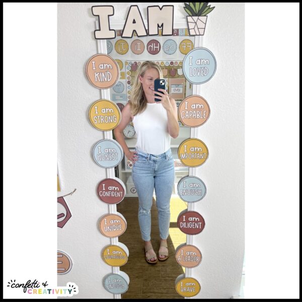 Modern-Neutral-Affirmation Station - Affirmation Mirror Selfie Shows Megan taking a selfie in an affirmation mirror surrounded by the affirmations in the modern neutral color scheme. Megan is wearing a white tank top and jeans smiling for the photo