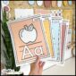 Shows the alphabet posters with pictures in a real classroom