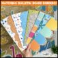 Shows the printable borders fanned out with the New Year's Bulletin Board in the background