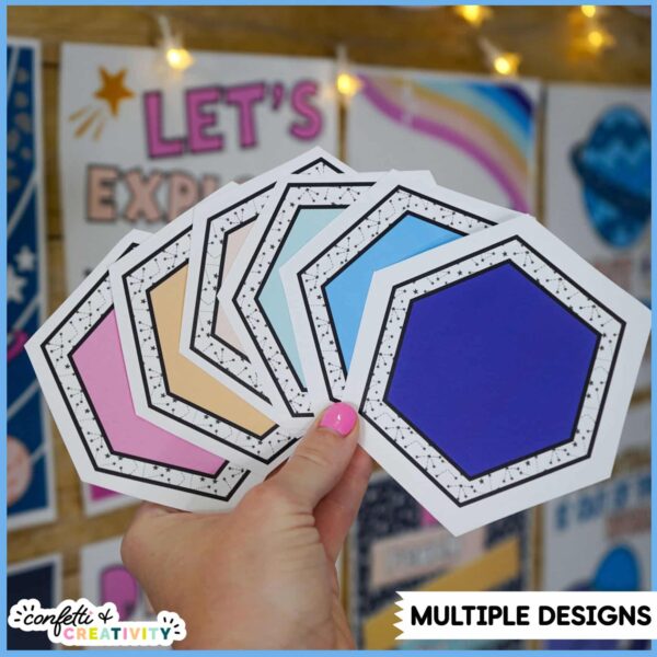 Space Classroom Labels 2 Shows fanned out classroom labels that are in the same color scheme as the space classroom theme