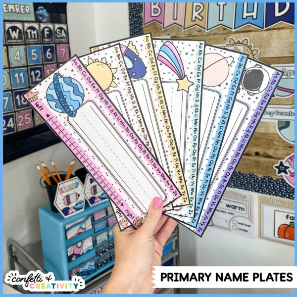 Space Desk Name Plates 4 Shows multiple examples of space themed student desk nameplates. Each design has no name it to show that teachers can write in the student names using a Sharpie marker