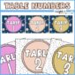 Shows two different designs of table numbers. One design is dark with planets, the second design is black and white with stars in motion