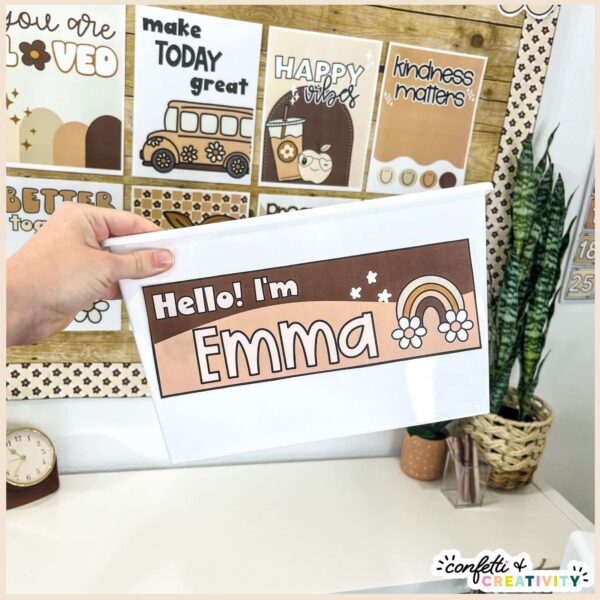 Neutral Desk Nameplates - Picture of Megan Holding Nameplate Shows a nameplate with the name Emma on it