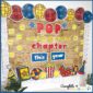 Bulletin Board with yellow, reds, and blues. The phrase on the board is "Poppin' Into a New Year"