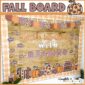 A preview photo for a Fall bulletin board that is reading focused. The phase on the board is "Fall in love with Reading". Includes warm Autumn colors and leafy clipart.